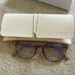 Rounded tinted pink glasses with case